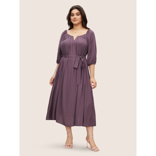 Plus Size Solid Notched Puff Sleeve Belted Flutter Hem Dress Mauve Women Elegant Cross straps Notched collar Half Sleeve Curvy Midi Dress BloomChic 18